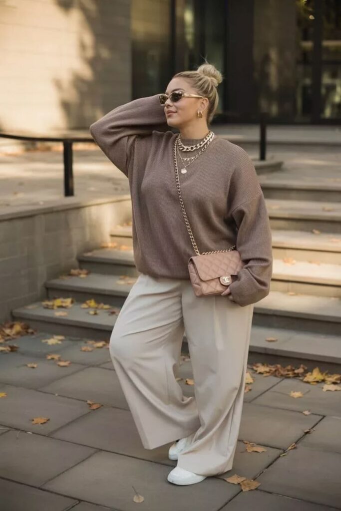 A petite woman wearing oversized clothes