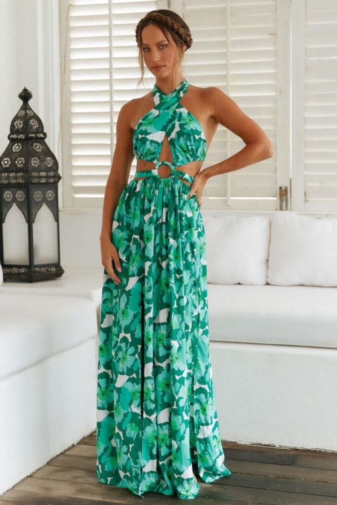 A Petite Woman Wearing A Halter Maxi Dress