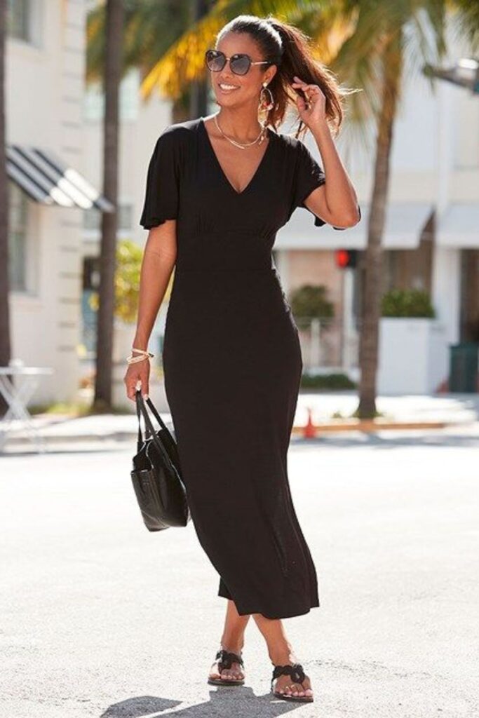 A Petite Woman Wearing A V Neck Black Dress