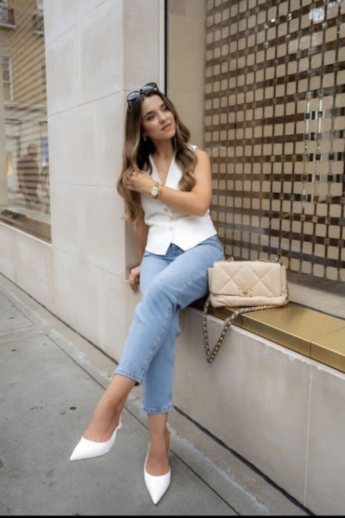 A Petite Woman Wearing Jean And Pointed-Toe Flats