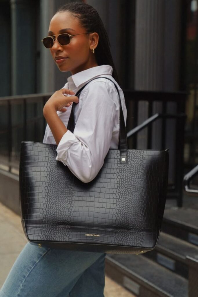 a petite woman carrying an Oversized Handbag